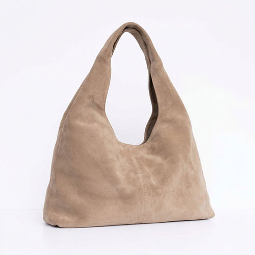 A taupe suede hobo shoulder bag with a single integrated strap.